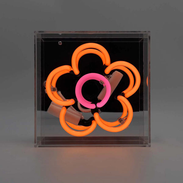quadratisches Neonröhren Leuchtschild, mit Form einer orange pinken Blume, Spiegel als Hintergrung und Plexiglasrahmen zum aufstellen