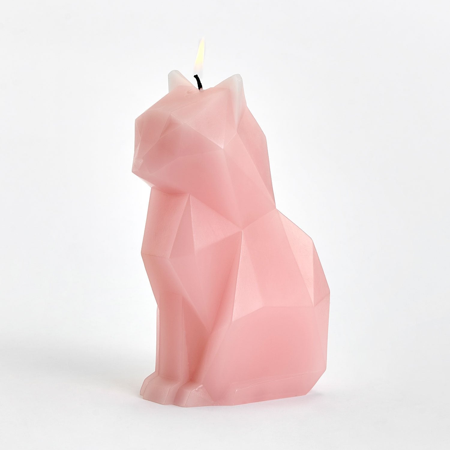 brennende Kerze in Form einer rosa Katze