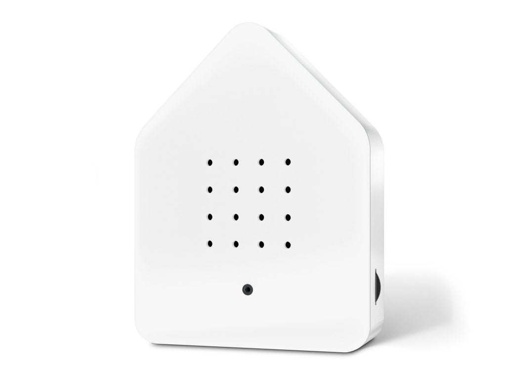 weiße Zwitscherbox in Form eines Hauses, Lautsprecher auf der Vorderseite