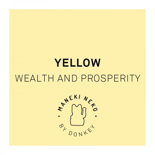 gelbe Winkekatze steht für Reichtum und Wohlstand